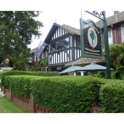 Bundanoon Hotel with hedge and sign